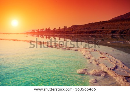 Seascape in the morning. Orange sunrise over Dead Sea. 