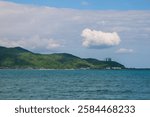 seascape with mountain and clouds