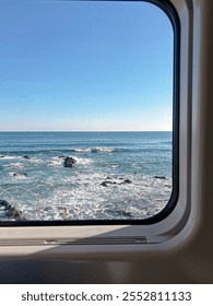 Seascape outside a train window