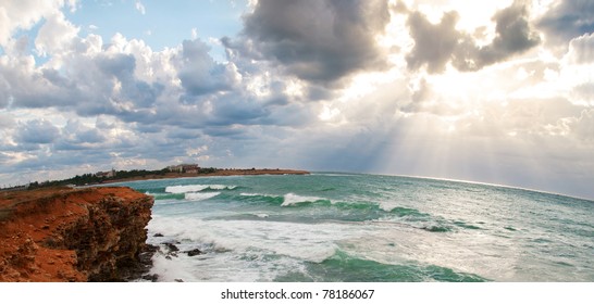Seascape. Rays of the sun breaking through clouds over the sea