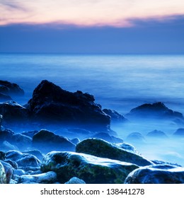 Seascape. Seashore With Misty Water At Sunset