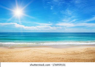 seascape and sun on blue sky background - Shutterstock ID 176959151
