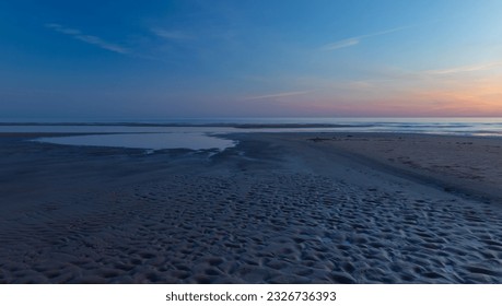 Seascape at sunset. Blue hour. The last rays of the sun color the sky. The night is coming. Latvia. Baltic Sea. - Shutterstock ID 2326736393