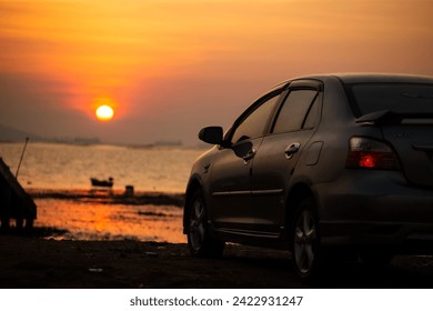 Seascape, sunset and cars background image - Powered by Shutterstock