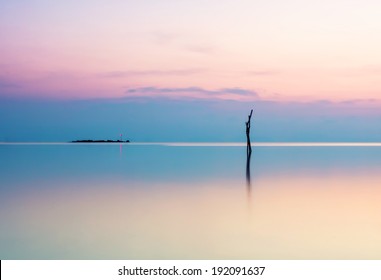 Seascape with sunset in a minimalist style