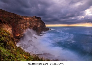 Seascape view of the big waves in the Nazare canyon. Big waves splashing against the rocks at Praia do Norte, Nazare - Portugal - Shutterstock ID 2138876495