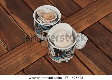 Seashell Collection Inside Patterned Ceramic Cups