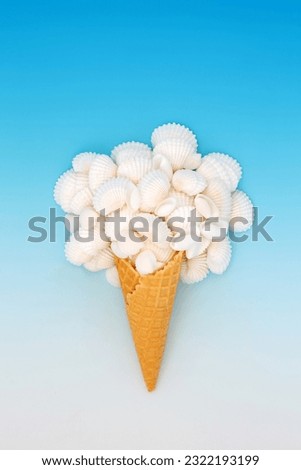 Seashell ice cream cone abstract summer design on gradient blue white background. Cockleshells nature food fun surreal abstract art composition.