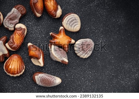 seashells candy chocolate sweet dessert eating meal food snack on the table copy space food background rustic top view