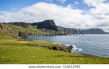 Seashore cliffs surrounding an ocean bay at Neist Point, Isle of Skye, Scotland