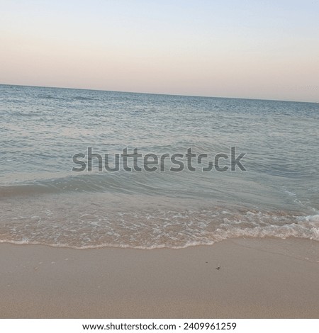 seaside beach seashore, view with sunsetting on opposite side of the sea calm seashore beachside
