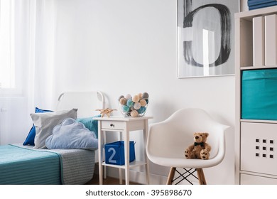 Seaside Decorations On Nightstand Near Blue Single Bed In Modern Children's Room