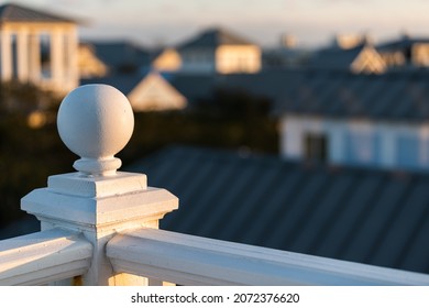 Seaside, Florida Closeup Of White Railing Balusters Beach Classic Architecture In Evening Sunset At Wooden Rooftop Tower Patio