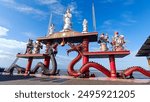 Seaside landmark of the Goddess Kwan Im and a pair of dragons at Sanggar Agung Temple, Kenjeran Park, Surabaya, Indonesia. This area is a place of worship for Buddhists, Confucians, and Taoists.