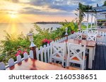 Seaside landscape - the cafe on the embankment view of the Old Town of Nesebar, in Burgas Province on the Black Sea coast of Bulgaria