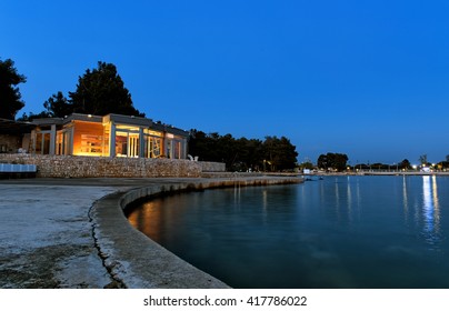 A Seaside Restaurant During Twilight.