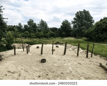 Seaside Serenity: Tranquil Beachscape with Wooden Stakes - Powered by Shutterstock