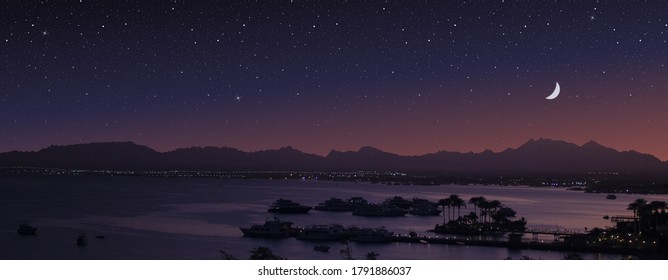 Seaside town and starry sky. Magic moonlight over the sea harbor. - Shutterstock ID 1791886037
