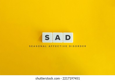 Seasonal affective disorder (SAD) banner. Winter Depression. Block Letter Tiles on Yellow Background. Minimal Aesthetics. - Shutterstock ID 2217197451
