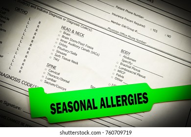 seasonal allergies green bracelet over top hospital paperwork