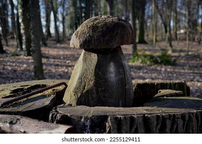 Seasonal bird feeder with made of right roof tiles made of burnt clay. Forest park seed, winter. Fungus shape made of carved wood. Children like such a house - Shutterstock ID 2255129411