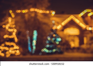 Seasonal Christmas House Lights Decoration, Outdoor Blurred Defocused View. Xmas Showcase