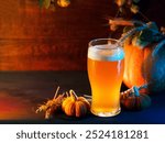 Seasonal craft beer . Ears of wheat, green hops and pumpkins on a wooden table. Copy space