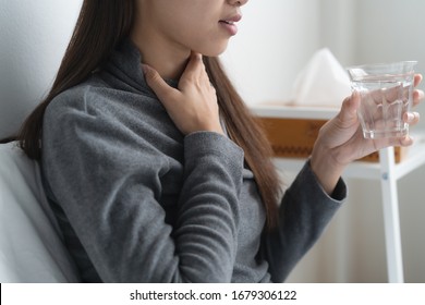 Seasonal Disease Symptom Concept. Bad Healthy Woman Touching Her Neck And Feeling Sore Throat From Strep Tonsils And Flu.