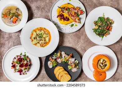 Seasonal Dishes Of Autumn Vegetables With Pumpkin And Mushrooms. Sturgeon Ear, Vinaigrette With Chanterelle Mushrooms, Mackerel And Herring Fillet With Cornbread And Mushroom Toast, Pumpkin Soup With 