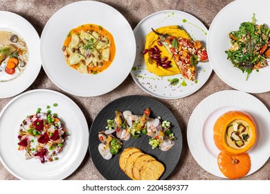 Seasonal Dishes Of Autumn Vegetables With Pumpkin And Mushrooms. Sturgeon Ear, Vinaigrette With Chanterelle Mushrooms, Mackerel And Herring Fillet With Cornbread And Mushroom Toast, Pumpkin Soup With 