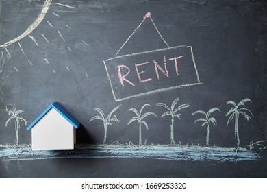 Seasonal house rent. Booking accommodation. Real estate market. Summer vacation and travel concept. Holiday trip. Chalk board background with beach exterior and house mockup with copy space