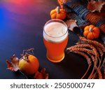 Seasonal pumpkin ale beer for Thanksgiving. Craft beer. Orange pumpkin, wheat ears and autumn leaves. Copy space