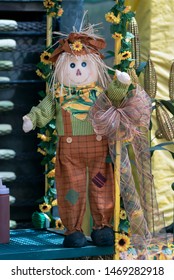 Seasonal Scarecrow Decorates The County Fair Booth As The Autumn Harvest Time Approaches.