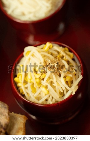 Seasoned bean sprouts in a wooden bowl, prepare food for ancestral rites table