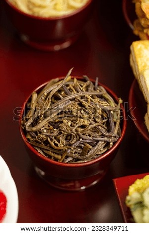 Seasoned bracken in a wooden bowl,prepare food for ancestral rites table