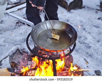 Seasoning Carbon Steel Pan With Lard On Open Camp Fire.