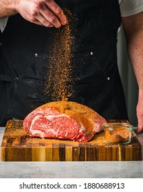 Seasoning a Prime Rib for Christmas Dinner - Shutterstock ID 1880688913