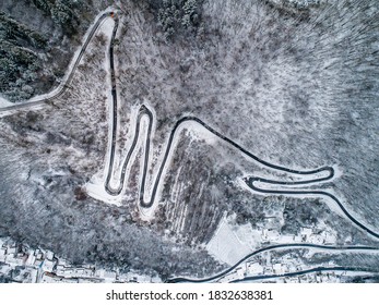 Seasons Concept winter snowy Aerial view Winding road serpentine mountain pass village Brodenbach Germany - Powered by Shutterstock