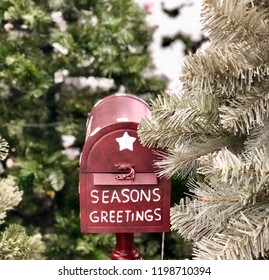 Seasons Greetings - Christmas Card Holder Mail Box Decoration Next To Christmas Tree