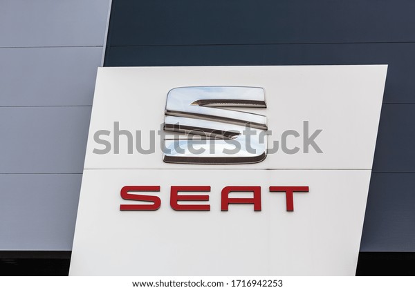 SEAT\
brand logo on bright blue sky background located on its dealer\
office building in Lyon, France - February 23,\
2020