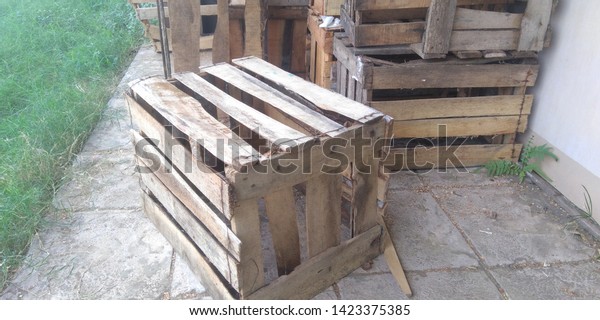 a seat from a fruit\
box