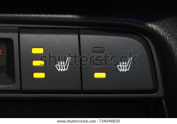 Seat heater button, car\
interior.