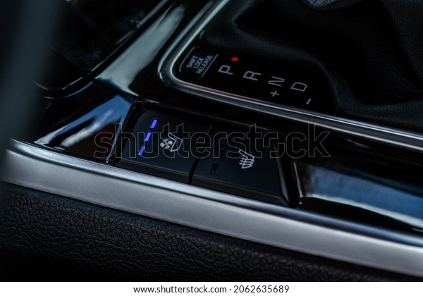 Seat heating controller buttons\
close up view. Car interior. Seat heater button, car\
interior.