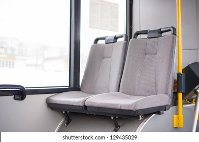 Seat Places In Front Side Of Modern City Trolley Bus With Turnstile