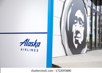 SeaTac, Washington / USA - March 26 2020: Alaska Airlines sign and logo at the company headquarters, with space for text