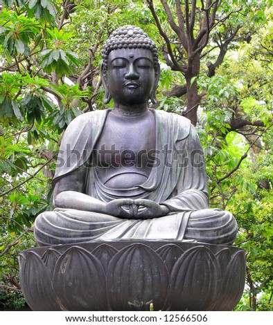 Seated Buddha statue at temple in Tokyo, Japan.