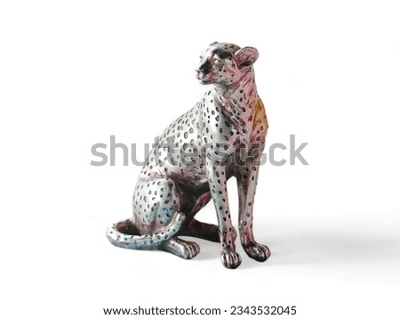 a seated leopard statue in silver on a white background