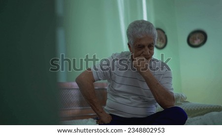 Seated Senior Man Struggling with Introspective Thoughts, Worried Expression in Deep Contemplation by Bedside Imagine de stoc © 