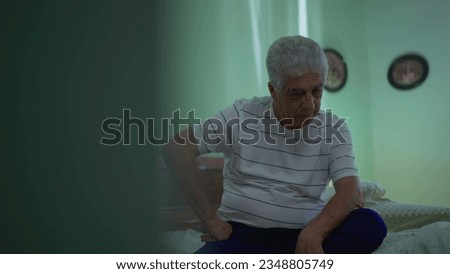 Seated Senior Man Struggling with Introspective Thoughts, Worried Expression in Deep Contemplation by Bedside