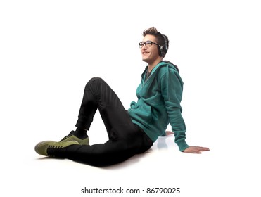 Seated young man listening to music - Powered by Shutterstock